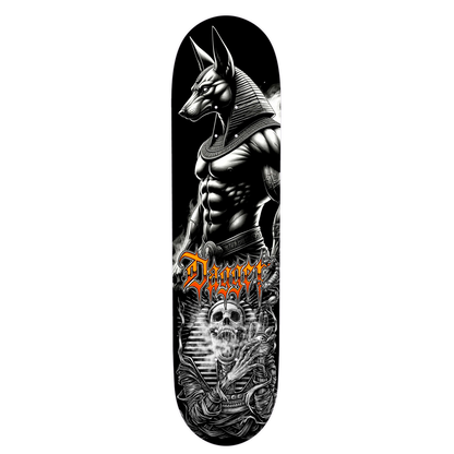 Dagger Skateboards deck featuring Anubis graphic artwork on a black and gold background